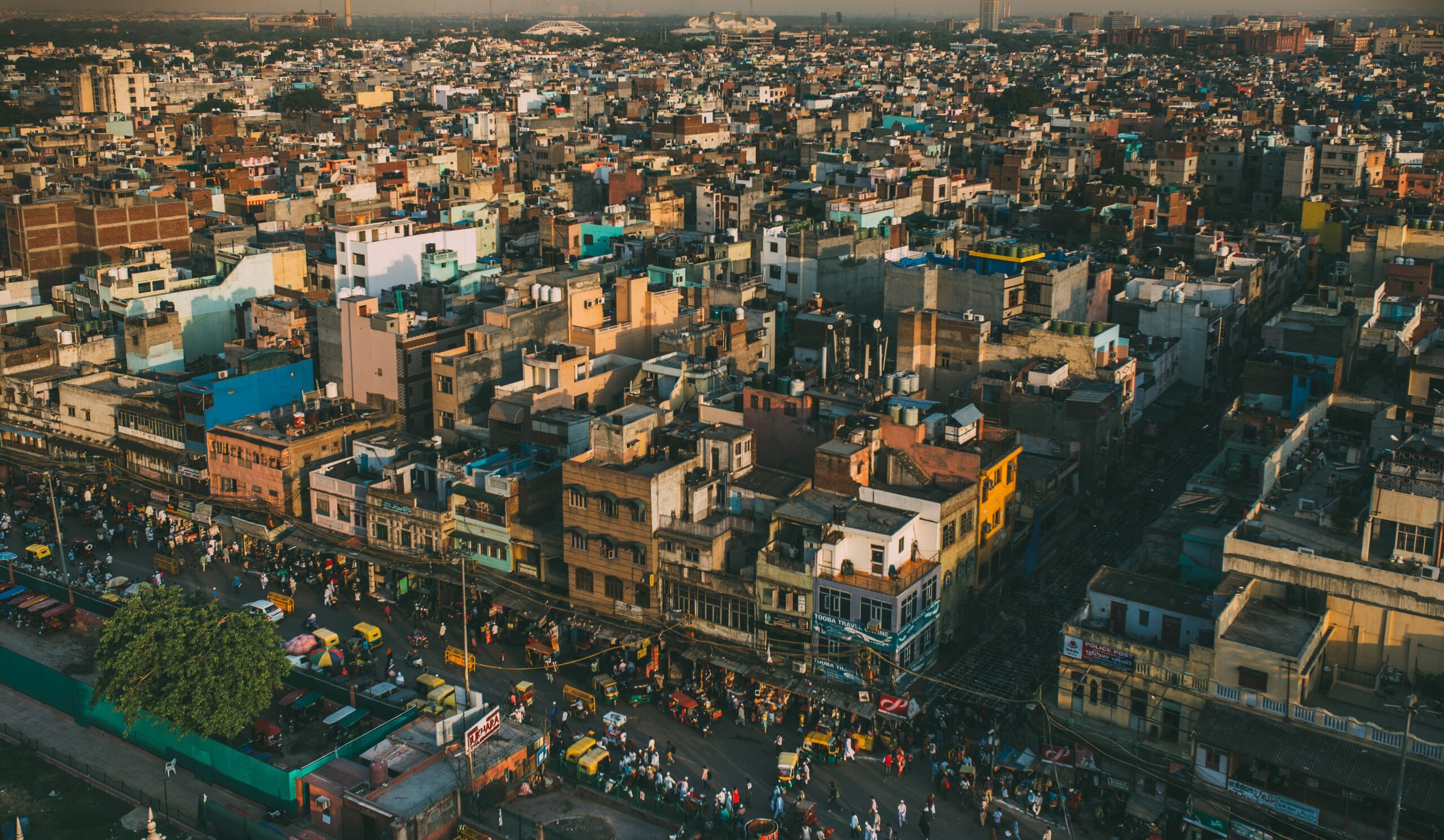 Delhi Circle Rate 2026: Latest Update, Category-Wise Rates & Complete Buyer's Guide A vibrant aerial cityscape of Delhi, showcasing the bustling streets and diverse architecture under warm daylight.